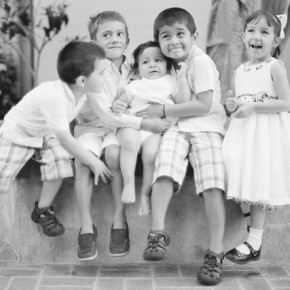 five kids pose for a picture