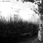 A couple in Cohasset, MA is caught walking by two photographers. Image by Katherine Deakin