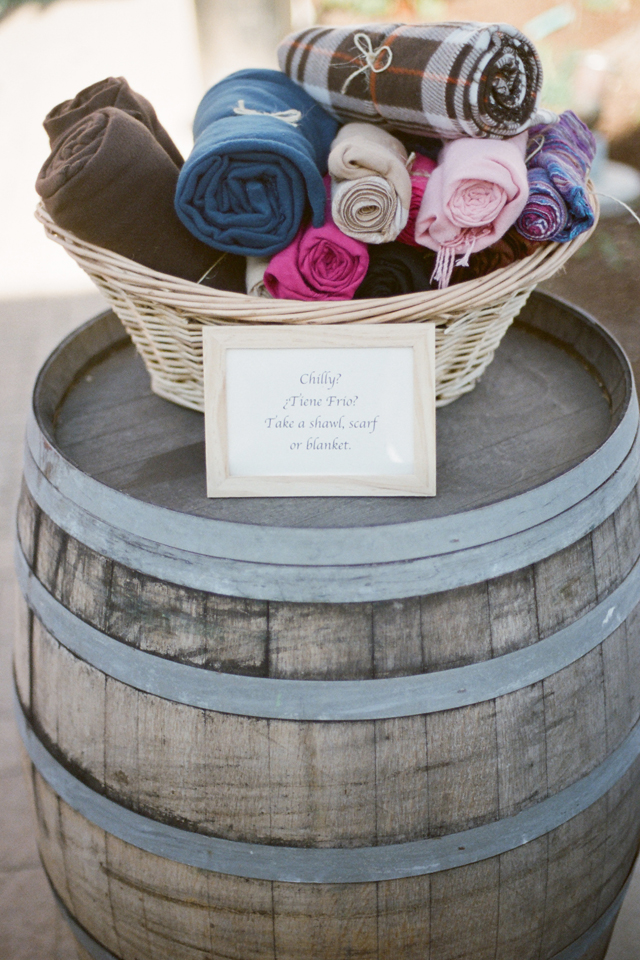 little blankets in a barrel at a wedding